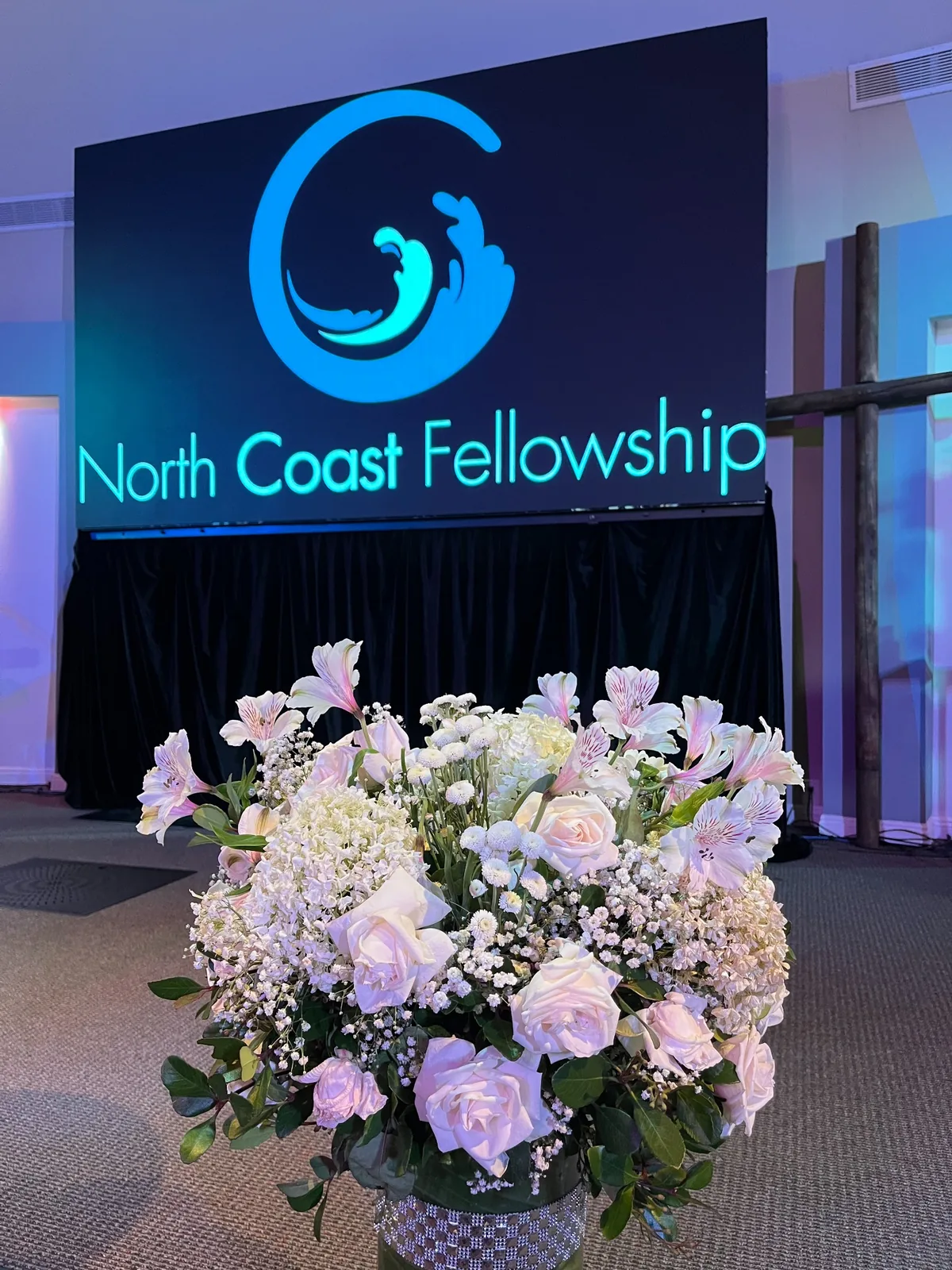 Flowers arranged inside the North Coast Fellowship sanctuary